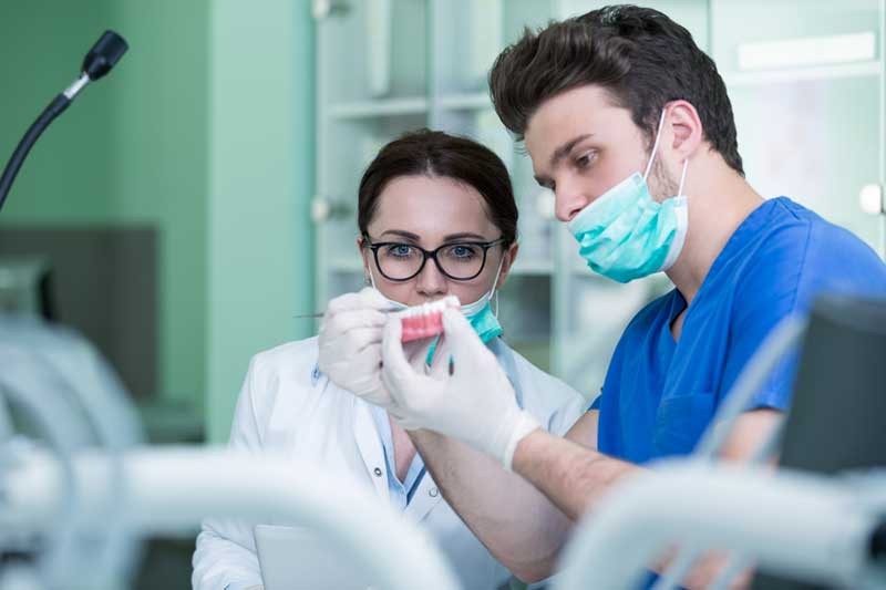 Two Dentists with Dummy Crown